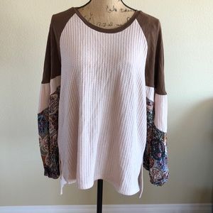 Waffle knit long sleeve with floral print sleeves.